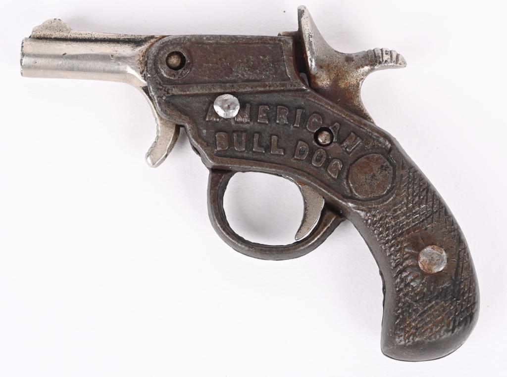 EARLY CAST IRON AMERICAN BULL DOG CAP GUN: Made by Kenton circa 1910. This gun has bored through barrel, tilt down, light hammer spring.