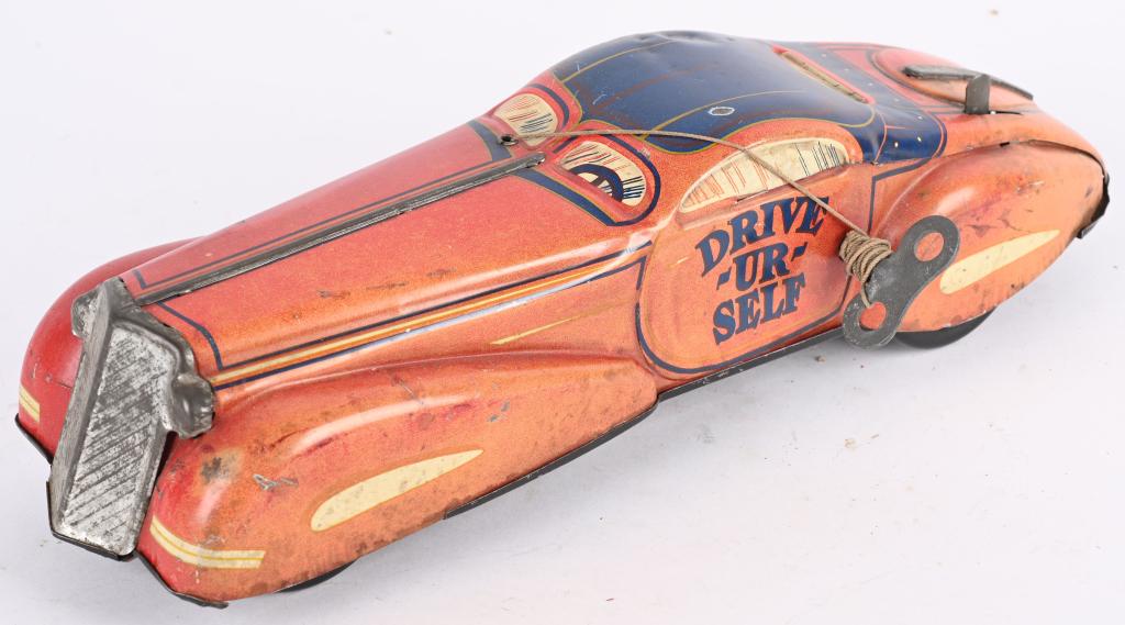 MARX TIN WINDUP DRIVE UR SELF CAR: All original. Windup work. Has some fading. 14" Very Good