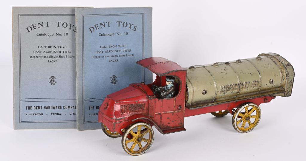 DENT CAST IRON MACK AMERICAN OIL TRUCK: Large and impressive cast iron Dent Mack American Oil Co. truck. Nice original paint and driver. No cracks or repairs. Steering wheel is cast iron. 15 1/2". Also included are two original Dent Toys ca