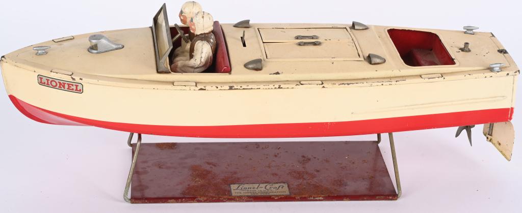 LIONEL TIN WINDUP SPEED BOAT: Original Lionel Speed Boat. All complete with original drivers and stand. Windup works.18" Very Good-Excellent
