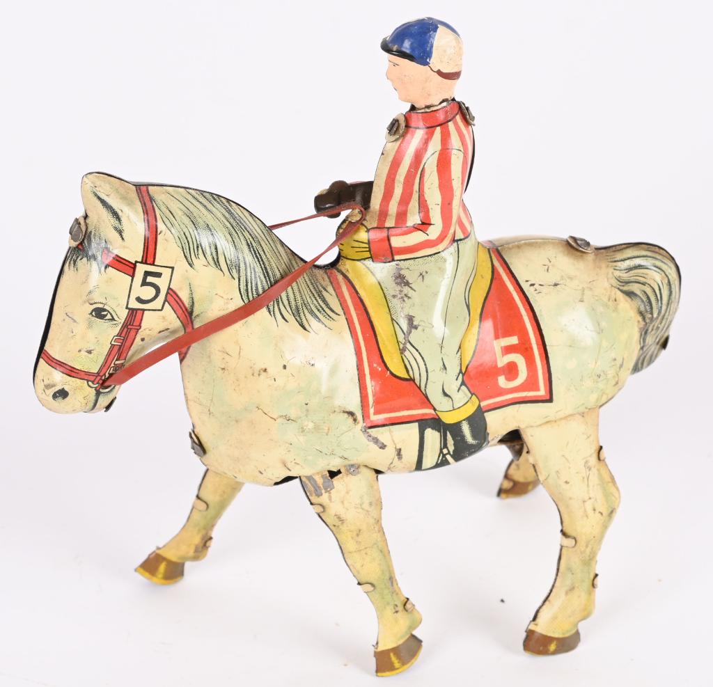 UZ ZONE GERMANY TIN WINDUP JOCKEY ON HORSE: All original and works. 5 1/2" Excellent