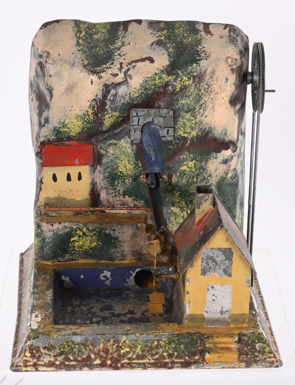 GERMAN STEAM TOY COTTAGE WITH WATER WHEEL: Early German Steam Toy Accessory. Hand Painted Tin. All original condition with some flaking paint . 6 1/2" Very Good-Excellent