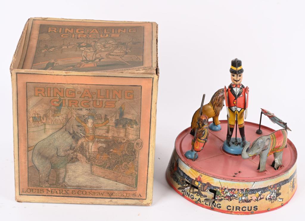 MARX TIN WINDUP RING-A-LING CIRCUS w/ BOX: Colorful all original toy with the original box. The toy worked well when tested. The Ring Master has a glue repair to tabs on one foot. Graphics are nice and has the harder to find pink base. The ori