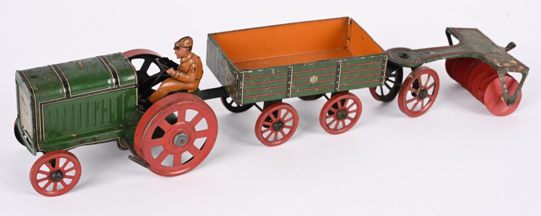 GUNTHERMANN TIN WINDUP TRACTOR & ACCESSORIES: All original made in Germany. Tractor come with Wagon and Plow. Windup works. Tractor measures 6 1/2" Very Good