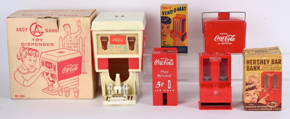COCA COLA TOYS & MORE: Includes Andy Gard Coca Cola Dispenser in Box, Coca Cola Bottle Vendor in Box, Coca Cola Bank, Coca Cola Cooler with 6 Packs, Hershey Bar Bank with Box, and Tell's Cigarette Vend-O-Mat with Box. Excel