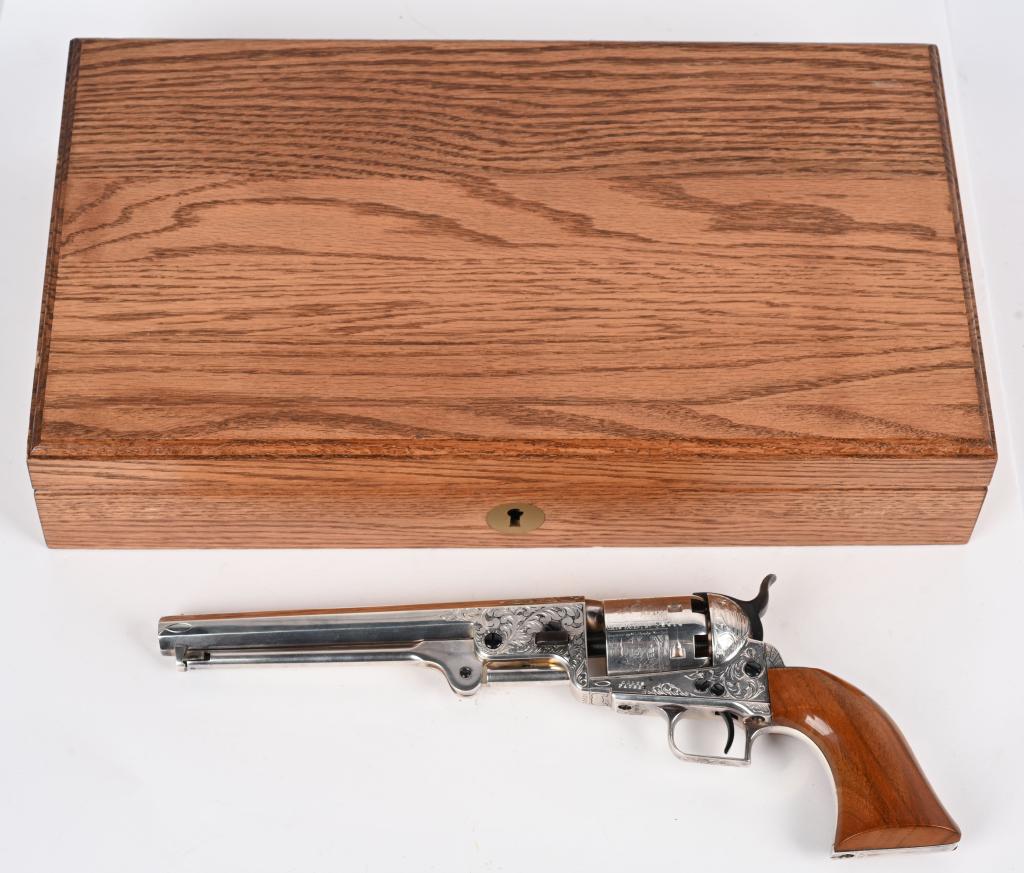 ENGRAVED SILVER PLATED COLT 1851 NAVY REVOLVER: SERIAL NUMBER 22510. BARREL 7.5". CALIBER .36. Colt black powder series gun that was engraved and silver plated. Hand engraved and attributed to David Perdue. The American Historical Foundation produc