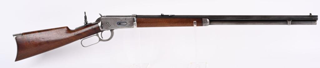 ANTIQUE WINCHESTER 1894 RIFLE CAL 25-35 WCF.: SERIAL NUMBER 104874 BARREL 26" CALIBER 25-35 WINCHESTER MANUFACTURED 1897 ACCORDING TO MADIS. Full octagon barrel with blade front sight and 3 leaf express sporting rear sight. Full magazine. 2 piece