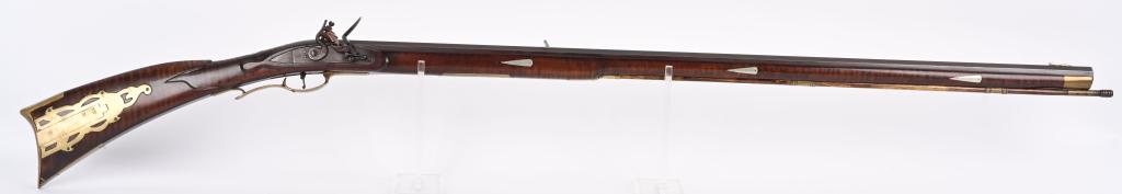PENNSYLVANIA PATTERN CONTEMPORARY FLINTLOCK RIFLE: SERIAL NUMBER N/A BARREL 42" CALIBER .50 RIFLED BLACKPOWDER MANUFACTURED CIRCA 1970'S. Large bore flintlock long rifle built in the Pennsylvania style with full length striped dark finished maple stoc