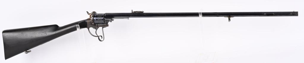 STUNNING 12MM PINFIRE LEFAUCHEUX REVOLVING CARBINE: SERIAL NUMBER 142 BARREL 28 3/8" CALIBER 12 MM PINFIRE MANUFACTURED CIRCA 1880. Wonderfully marked "E. LEFAUCHEUX EN BREVETS" on left side of the barrel trunnion. Bright polished blue finish with octa