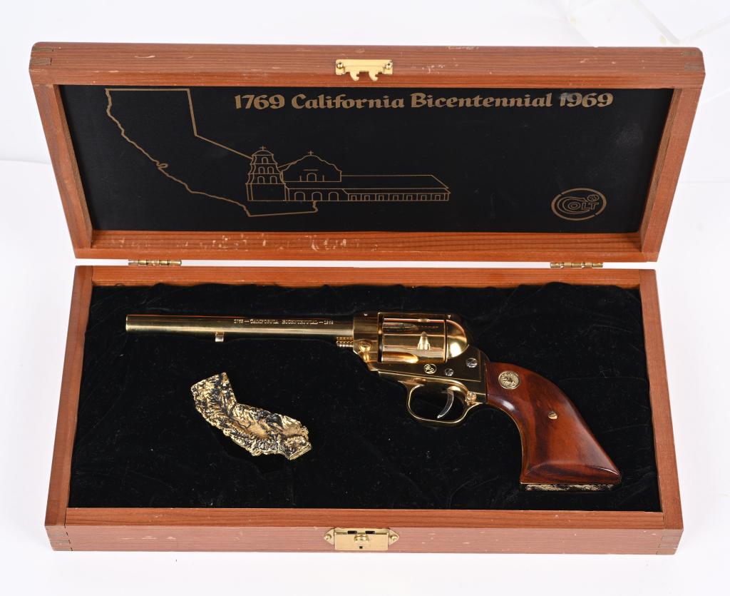 COLT FRONTIER SCOUT CALIFORNIA BICENTENNIAL: SERIAL NUMBER: 47CBI. BARREL: 6". CALIBER: .22LR. MANUFACTURED: 1969. Made to celebrate 200 years of settlement in California. Blade front sight and u-notch frame rear. Gold washed finish. Oiled wood 