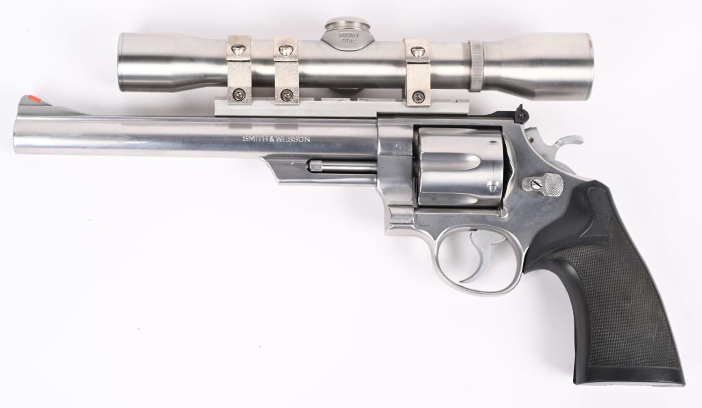 STAINLESS SCOPED SMITH & WESSON 629-1 REVOLVER: SERIAL NUMBER N932609. BARREL 8.5". CALIBER .44 MAGNUM MANUFACTURED 1982-86. Built on N-frame and sporting a stainless Micro Trac scope with rings. Six shot, double action, wide spur hammer. Has red i