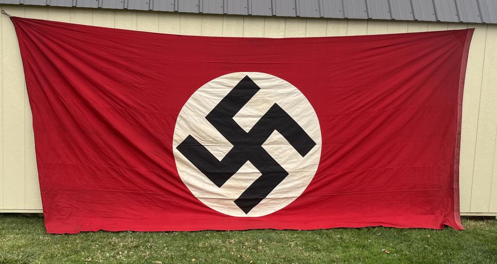 WWII NAZI GERMAN LARGE NSDAP FLAG 82 X 170 WW2: Large two sided cotton multi piece construction flag measuring approx. 82" x 170". Each side features a circular white field with a separately applied mobile swastika sewn to the base. The hoist end