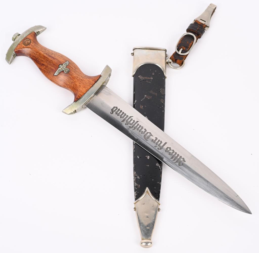 WWII NAZI GERMAN NSKK M33 DRESS DAGGER BY KOBER: Roughly, 22cm long, double edged, nickel/silver plated, drop forged steel construction blade with a low central ridge. The blade shows the expected scabbard runner marks with most of the original cros
