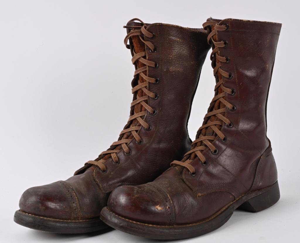 WWII U.S. ARMY AIRBORNE PARATROOPER JUMP BOOTS: Pair of brown leather boots with leather laces, 11-eyelet, with capped toes and reinforced heels. Two-piece solid rubber soles. This style of boot was first introduced during World War II for use by A