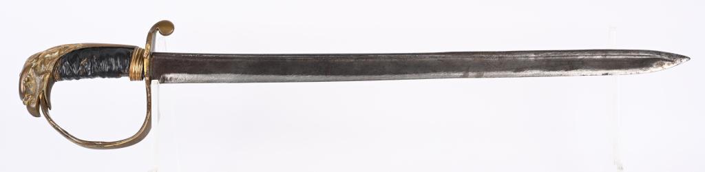 WAR OF 1812 EAGLE HEAD POMMEL SWORD: Shortened Eagle Head Officer's sword measuring 23 inches long with a 18 inch blade. The brass hilt shows an incredible amount of detail. This sword was used extensively in the War 1812.