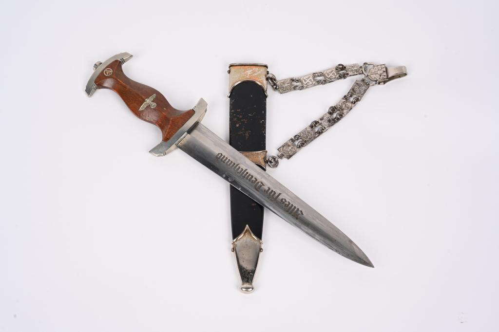 WWII NAZI GERMAN NSKK CHAINED GROUND ROHM DAGGER: German World War II NSKK Chained Officers Motor Korps Dagger & Scabbard. Measures 14 3/4" long overall. The front of the etched steel blade reads â€˜Alles fur Deutschlandâ€™ (Everything for G