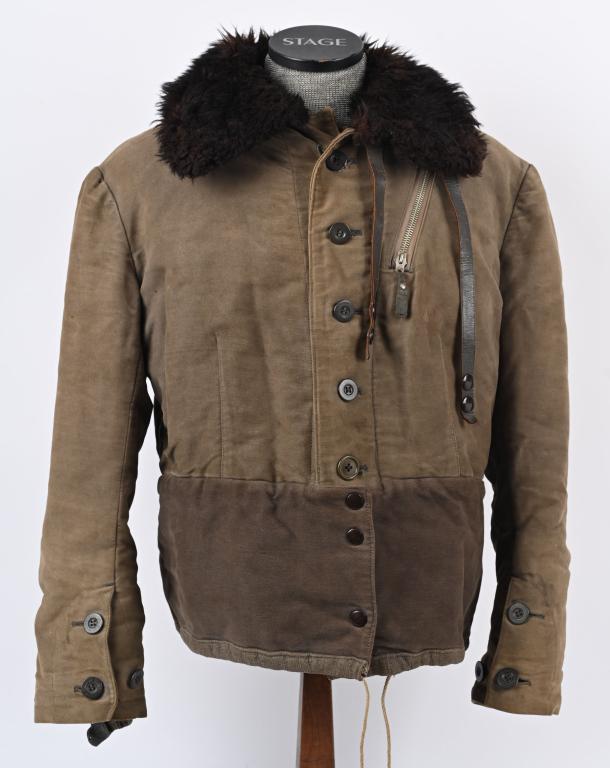 WWII NAZI GERMAN LUFTWAFFE WINTER FLIGHT JACKET: Nice quality, multi-panel Luftwaffe blue/gray cloth, construction fully lined, waist length, winter flight jacket with a large, chocolate brown fleece, lay down collar. The jacket features a vertical,