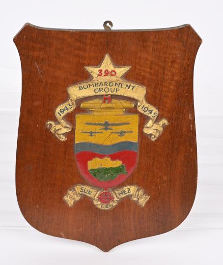 WWII US AIR CORPS 390TH BOMB GROUP READY ROOM SIGN: WWII 390th Bomb Group plaque from the ready room of the group. This wood plaque measures 11 X 8 1/2 inches bearing the crest of the unit that is hand painted in excellent condition. World War II Train