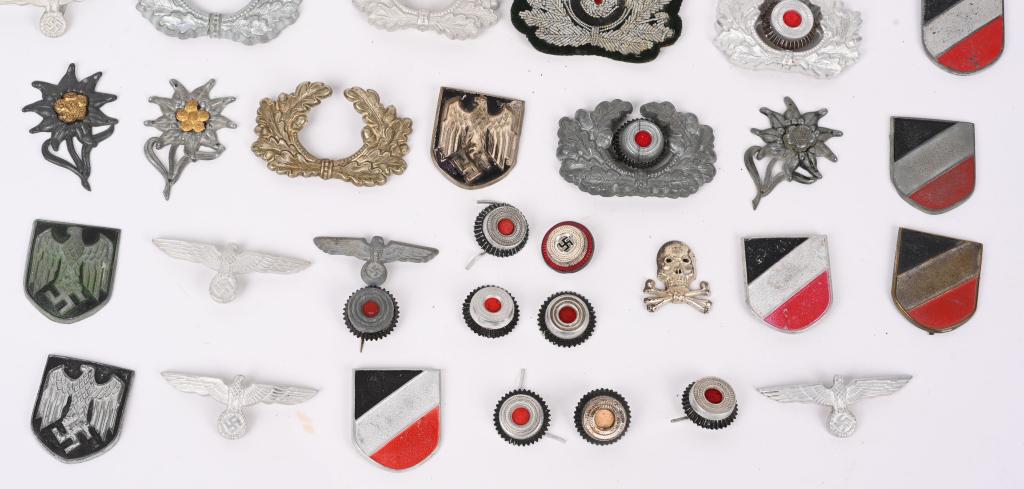 WWII NAZI GERMAN VISOR CAP INSIGNIA EAGLES COCKADE: WWII Nazi German insignia lot to include 1) TROPICAL PITH HELMET INSIGNIA. A total of 3 National Eagles (One with all its prongs, One with 1 missing and One without prongs) 5 National Shields, all wit