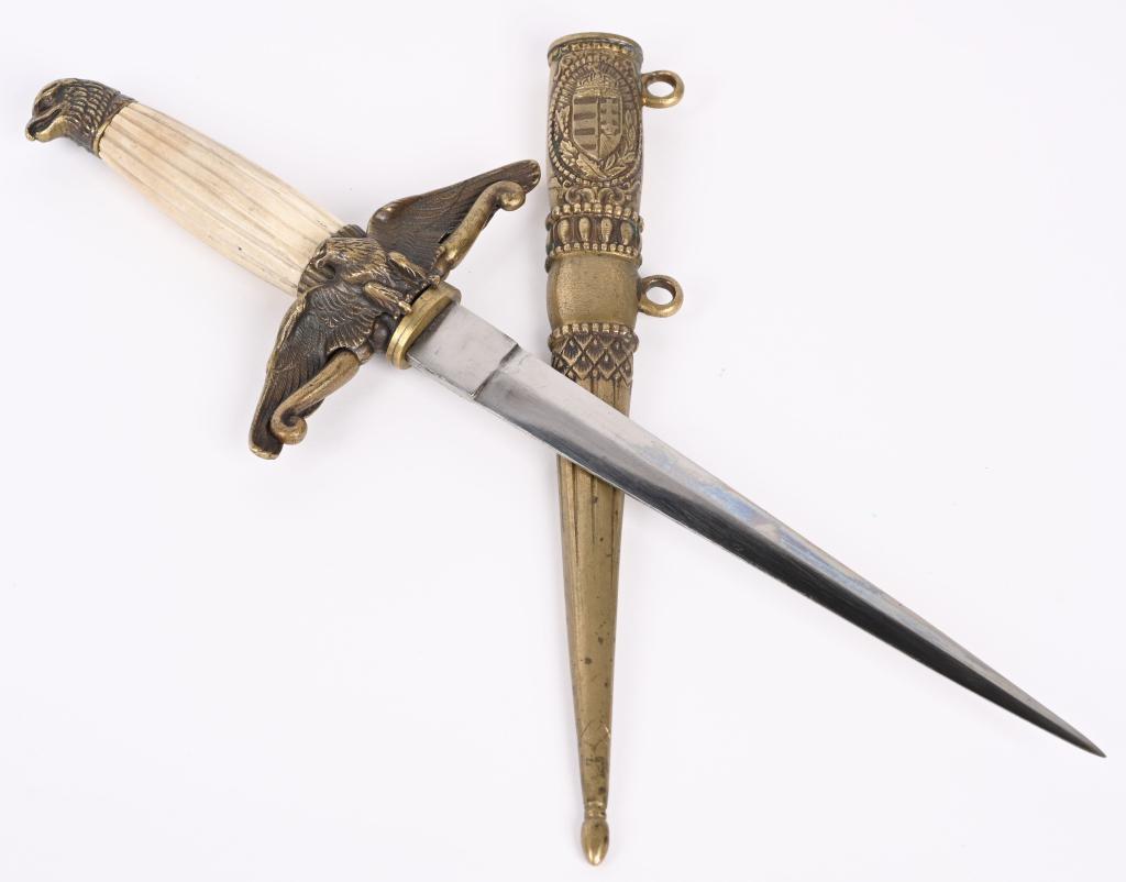 WWII HUNGARIAN ROYAL AIR FORCE DAGGER WW2: WWII Hungarian NCO Air Force dress dagger with plane blade. The blade is in immaculate condition. The grip is a excellent example with a few minor chips to the reverse. The detail in the metal parts a