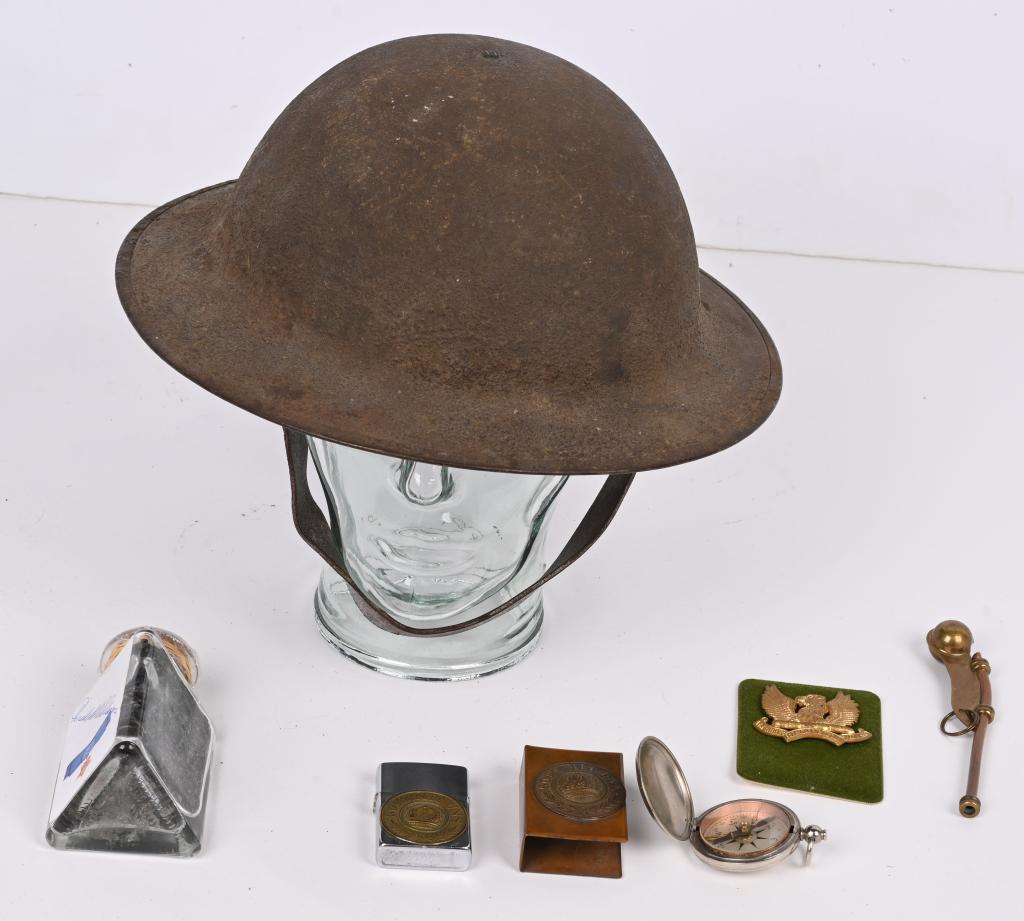 WWI US HELMET TRENCH ART GRENADE MATCH SAFE LOT: Lot of WWI & WWII Militaria to include 1) Helmet is the typical M1917 version, basin-shaped with a small rivet to the apex of the crown with original paper tag that fixes the internal liner, and two m