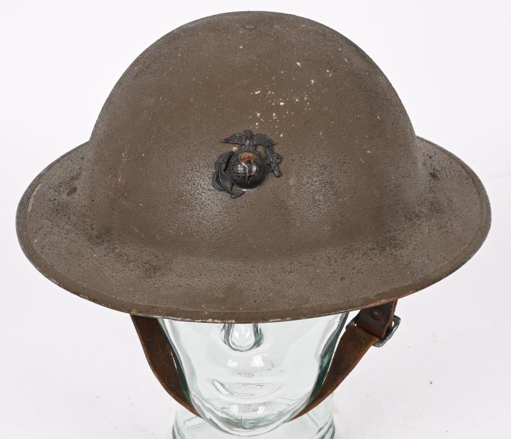 WWI US MARINE CORPS COMBAT HELMET USMC WW1: US made non-magnetic hardened manganese steel helmet. 1916 pattern is basin-shaped with a small rivet to the apex of the crown, fixing the internal liner, and two small rivets along the apron, one ove