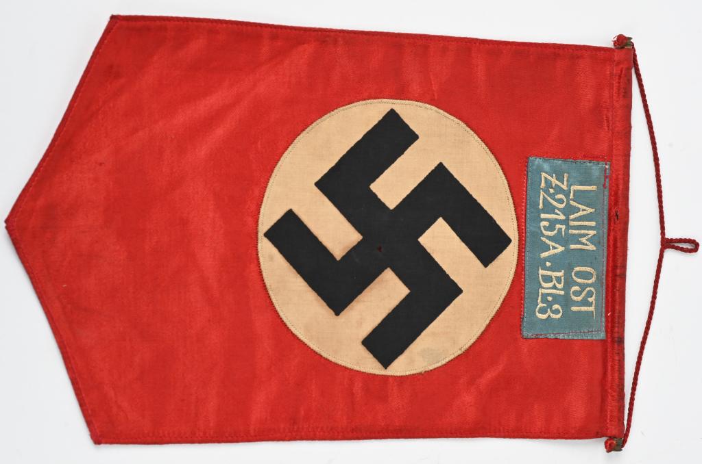 WWII NAZI GERMAN NSDAP UNIT MARKED FLAG / PENNANT: WWII Nazi German NSDAP Unit Marked Pennant measuring 11 1/2 X 8 in excellent condition. There is a unit marked with a chain stitched blue patch to one side "LAIM OST Z215A-BL-3" in excellent condition