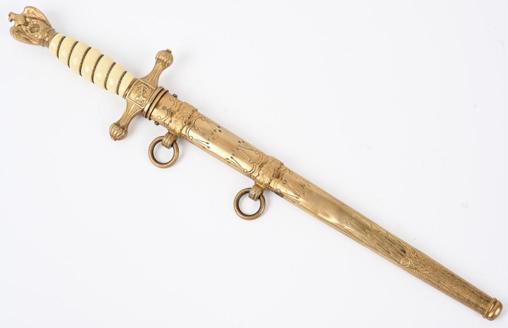 WWII NAZI GERMAN KRIEGSMARINE OFFICER'S DAGGER WW2: Roughly 25cm long drop forged steel nickel/silver plated stiletto style blade with dual narrow central fullers. Blade features the standard acid etched design of fouled anchors and ornate foliage patt