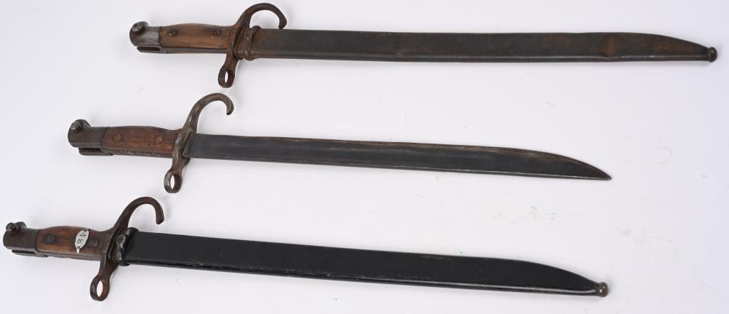 WWII JAPANESE TRAINING BAYONET LOT W/ TYPE 30 WW2: WWII Japanese Bayonet lot to include 1) (IJA) INFANTRY "TYPE 30" BAYONET. Type bayonet and scabbard. Serial numbers and manufacturer’s stamps are evident to the head of the blued, flat-sided bir