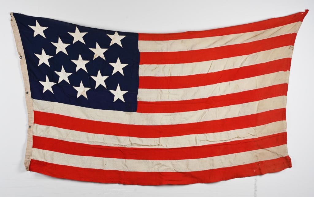 WWI US NAVY ENSIGN DATED 1914 NEW YORK NAVAL YARD: WW1 US Naval Ensign flag from the New York Naval Yard and is dated September 1914 and has 13 applied stars. Very Good with normal wear and tear.