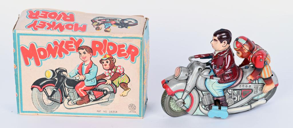 KANTO TIN WINDUP MONKEY RIDER w/ BOX: Kanton tin windup Monkey Rider. Made in Japan. All original Man riding motorcycle with monkey on the back. Windup works and and bikes rolls along while monkey hops on and off. Toy has great colors. Wi