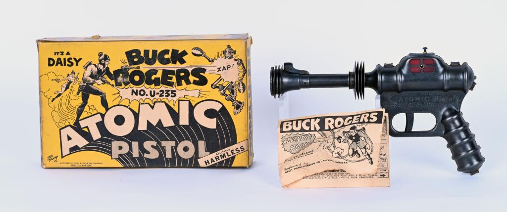 DAISY BUCK ROGERS ATOMIC PISTOL w/ BOX: Daisy #U-235 Atomic Pistol. All original and working. Very nice original condition. Comes with Box and Instructions. 9 1/2" Excellent