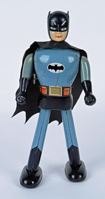 TADA TIN WINDUP LONG LEG BATMAN: Japan tin windup Long Leg Batman made by Tada. Very nice example of this very rare toy. Has nice colors and shine. Still has original vinyl head. Windup works. Does have some light wear, missing on/of