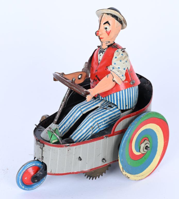 LEHMANN TIN WINDUP PETER CLOWN CAR: German tin windup Peter Clown Car. Super clean all original example. Very nice bright colors. Windup works. 4 1/2" Excellent