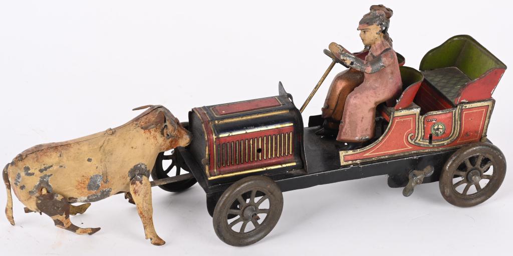 HANS EBERL CONFRONTATION CAR w/ STEER: German tin windup Confrontation Car. Tin litho car with hand painted riders that has a hand painted steer in front stopping it. All original condition. Windup needs repair. A very scarce toy! 11" very