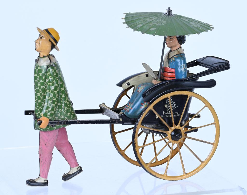 LEHMANN TIN WINDUP MASUYAMA: Lehmann tin windup Masuyama. All original and complete. Toy has beautiful colors. Windup works. A very nice Lehmann toy. 7 1/2" Excellent