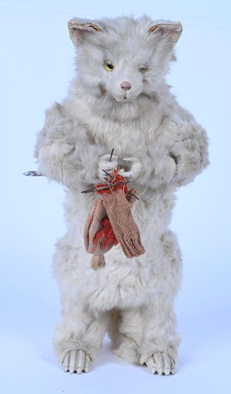 ROULLET DECAMPS CLOCKWORK KNITTING CAT: Early French clockwork Musical Knitting Cat by Roullet DEcamps. All original with wonderful details. Real fur body with wooden feet and hands. Has glass eyes. Windup and music works. Head nods and Cat