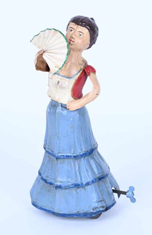 GUNTHERMANN HAND-PAINTED WINDUP LADY WITH FAN: Beautiful German Hand-Painted Tin Lady with Fan. Windup works. Professionally restored. 7 1/2" Excellent