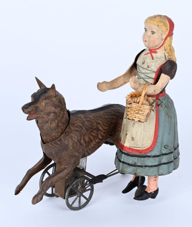 GERMAN HAND-PAINTED WINDUP BAVARIAN GIRL & DOG: Wonderful German Hand-Painted Tin Bavarian Girl with German Shepard. Professionally restored to the highest standards. Windup works. 7" Excellent