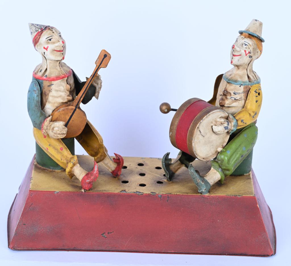 GUNTHERMANN HAND-PAINTED WINDUP CLOWN MUSICIANS: Wonderful German Hand-Painted Tin Seated Clown Musicians. One Clown playing Base Drum and other playing the Banjo. Toy has been professionally restored to the highest standards. Windup works and plays