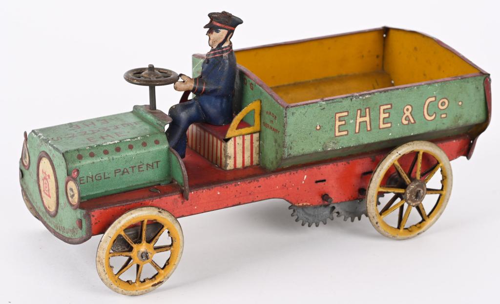 LEHMANN TIN WINDUP EHE & CO TRUCK 'GREEN': Scarce 'Green' Lehmann EHE & Co Truck. All original and complete with driver. Windup works. Very rare green color not the normal white. 7" Excellent