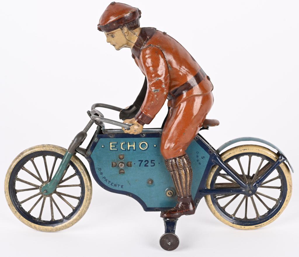 LEHAMNN TIN WINDUP ECHO MOTORCYCLE: Excellent early Lehmann Echo Motorcycle made in Germany. All original and complete. Has very nice colors. Windup works. Tuff to find in this condition. 9" Excellent