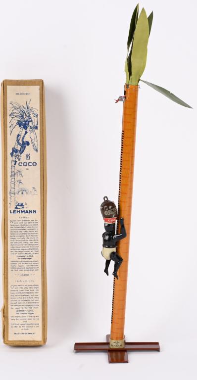 LEHMANN COCO w/ BOX: RARE German tin weight climbing toy. Great looking Native climbs Palm Tree. All original and complete with Coconut weight. Toys has very nice colors and shows almost no use. Comes with scarce box with