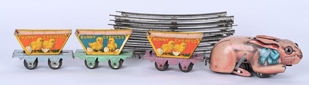 MARX WINDUP EASTER BUNNY EXPRESS: All original and complete with Bunny, 3 Cars, and Track. Great graphics. Windup works. Bunny measures 8 1/2" Very Good-Excellent