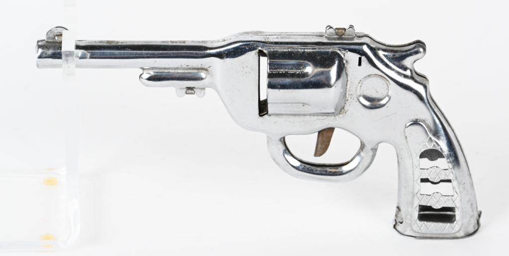 MARX PROTOTYPE CLICKER GUN: Marx Prototype Clicker Gun. Chrome finish with cut-outs on grips. Plus bottom of grips is hinged and opens. 8 1/2"