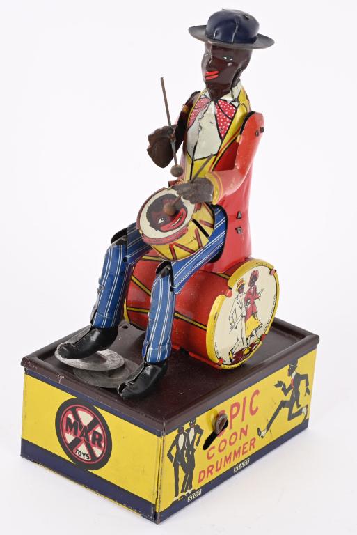 MARX TIN WINDUP SPIC COON DRUMMER: Marx windup Spic Coon Drummer. All original and complete including both arms and the drum. Toy has very nice colors. Windup works. Very nice example of a very hard to find toy. 8 1/2" Excellent