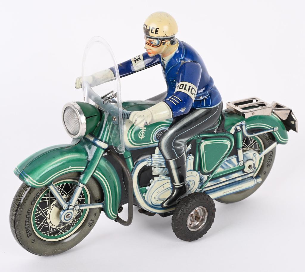 TIPP TIN FRICTION POLICE MOTORCYCLE: German tin friction Police Motorcycle. All original and complete. Toy has great colors. Friction works. Large impressive motorcycle. 11" Excellent