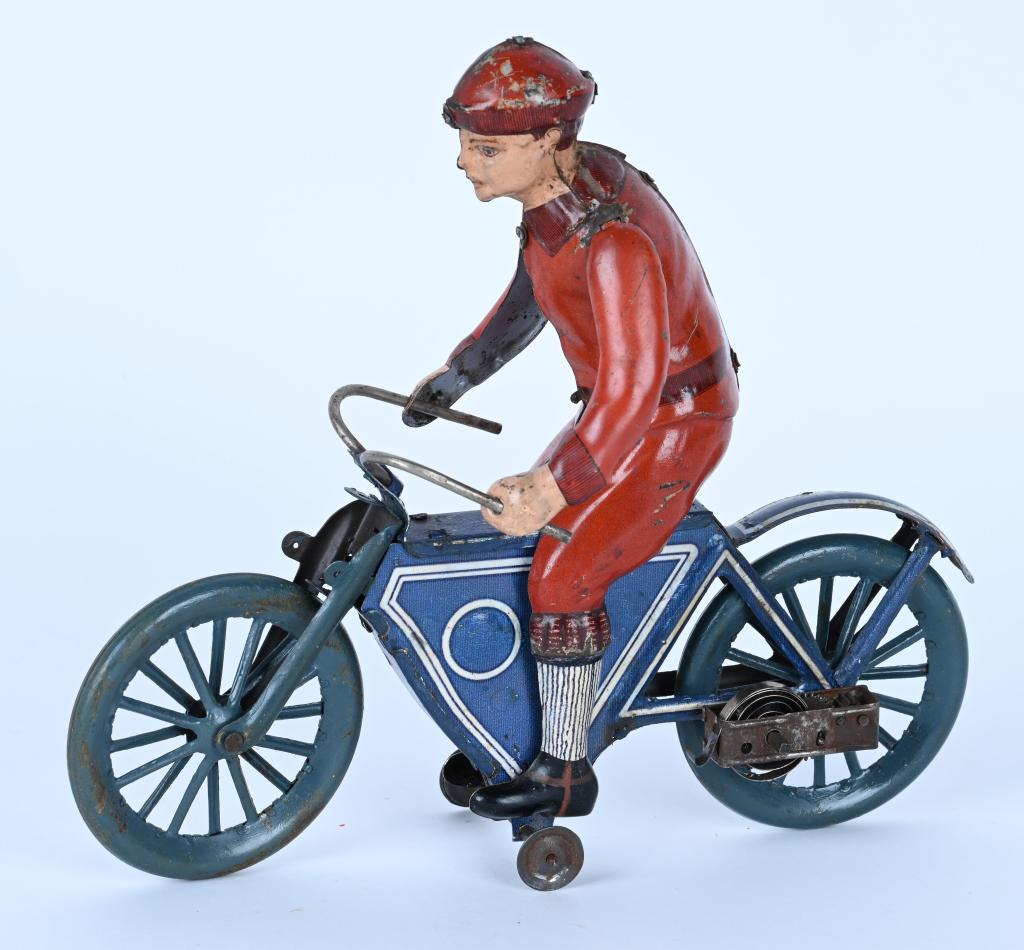 FISHER TIN WINDUP MOTORCYCLE WITH RIDER: German windup Motorcycle with Rider. Nice original early Motorcycle toy. Windup works. Rider has replaced arms. Great looking early toy. 7 1/2" Excellent