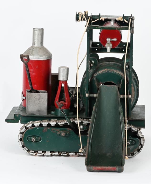 BUDDY L CONCRETE MIXER ON TREADS: Scarce Buddy L Concrete Mixer on Treads. Very large and impressive toy with lots of details and moving parts. Toy has some period repaint. Displays great. Comes with accessory shovel. 16" Very Good-Ex