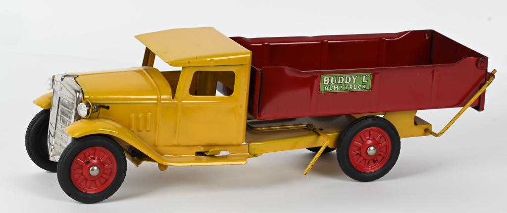 BUDDY L DUMP TRUCK w/ ELECTRIC HEADLIGHTS: Buddy L pressed steel Dump Truck with Electric Headlights. Outstanding original condition. Toy has great paint and decals. Has separate nickel grill and working Headlights. A super clean truck. 19" Ex